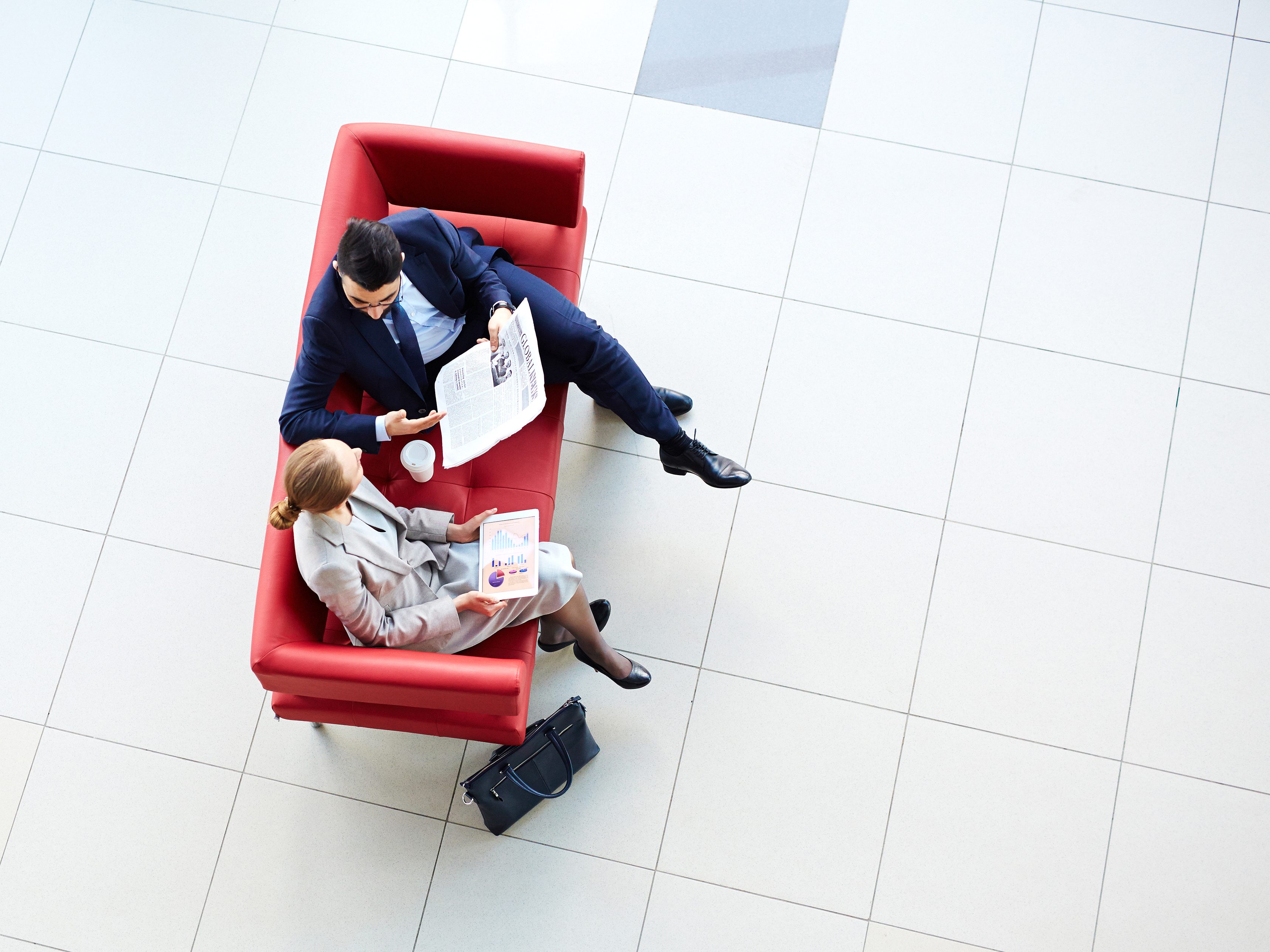 Overhead view of team on red couch